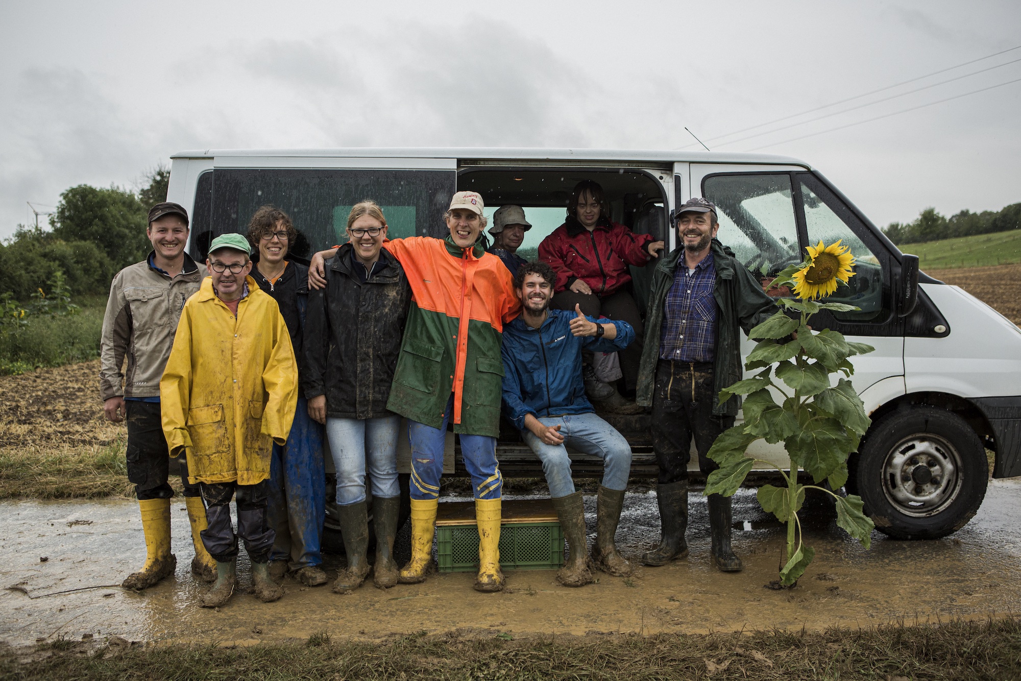 Team of farmers in rain